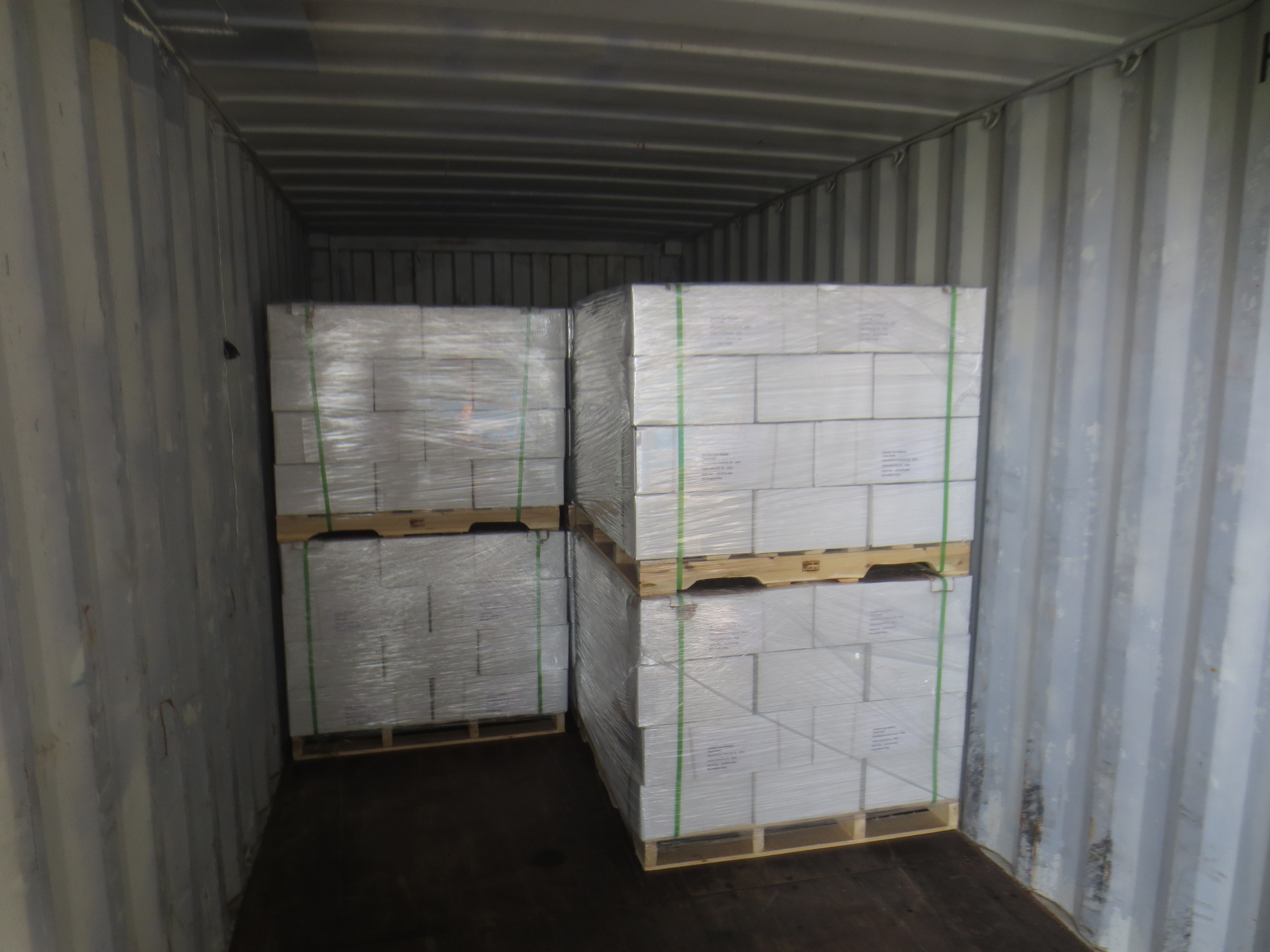 How does xanthan gum improve texture stability in commercial bakery operations?